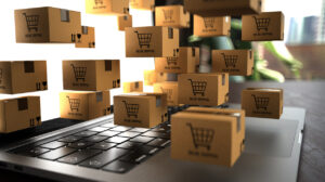 Symbolbild Online-Shopping: Laptop und viele Mini-Pakete
